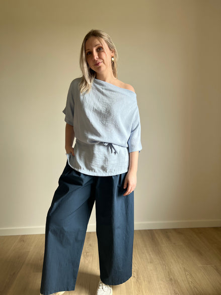 Blue draped wrap blouse