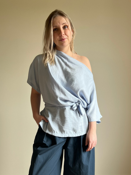 Blue draped wrap blouse