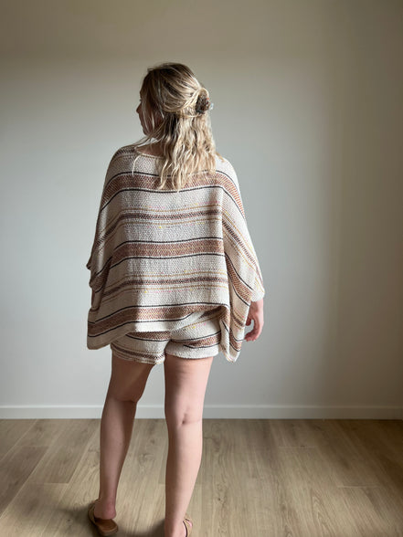 Knitted poncho - cream striped